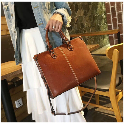 Black Elegant Leather Handbag - StylishTote with Adjustable Strap, Spacious and Durable