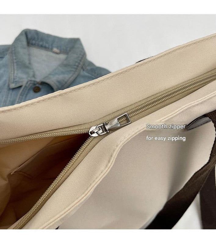 Stylish white canvas tote bag with detachable shoulder strap