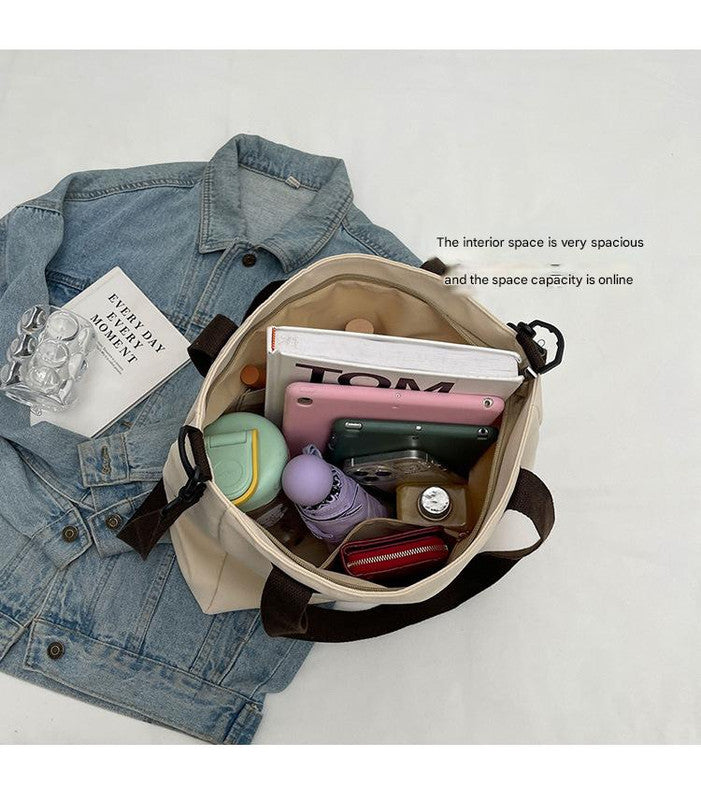 Stylish khaki canvas tote bag with detachable shoulder strap