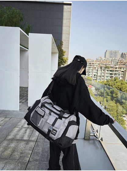 Grey Unisex Travel Bag with Utility Buckles and Wet/Dry Compartments