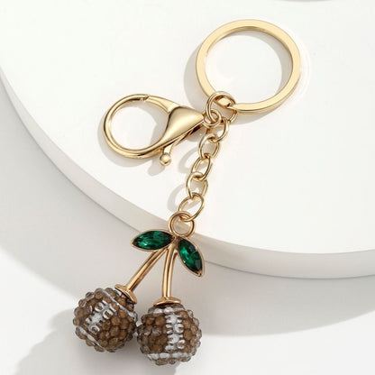 2 Pcs Brown rugby ball shape Creative Sports Ball Cherry Keychain – Cute Resin Charm for Car Keys, Bags & Backpacks