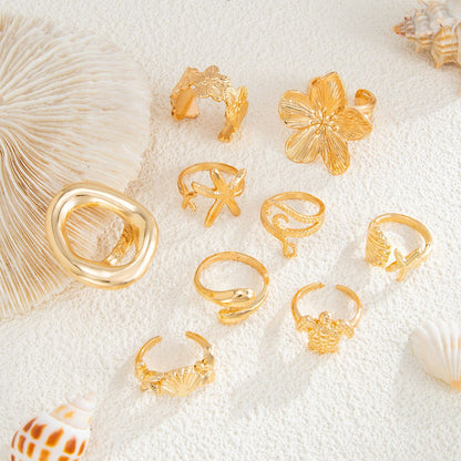 9-Piece Pale Gold Ocean-Inspired Stackable Ring Set - Metal Sea Turtle Starfish Floral Adjustable Open Finger Jewelry for Women
