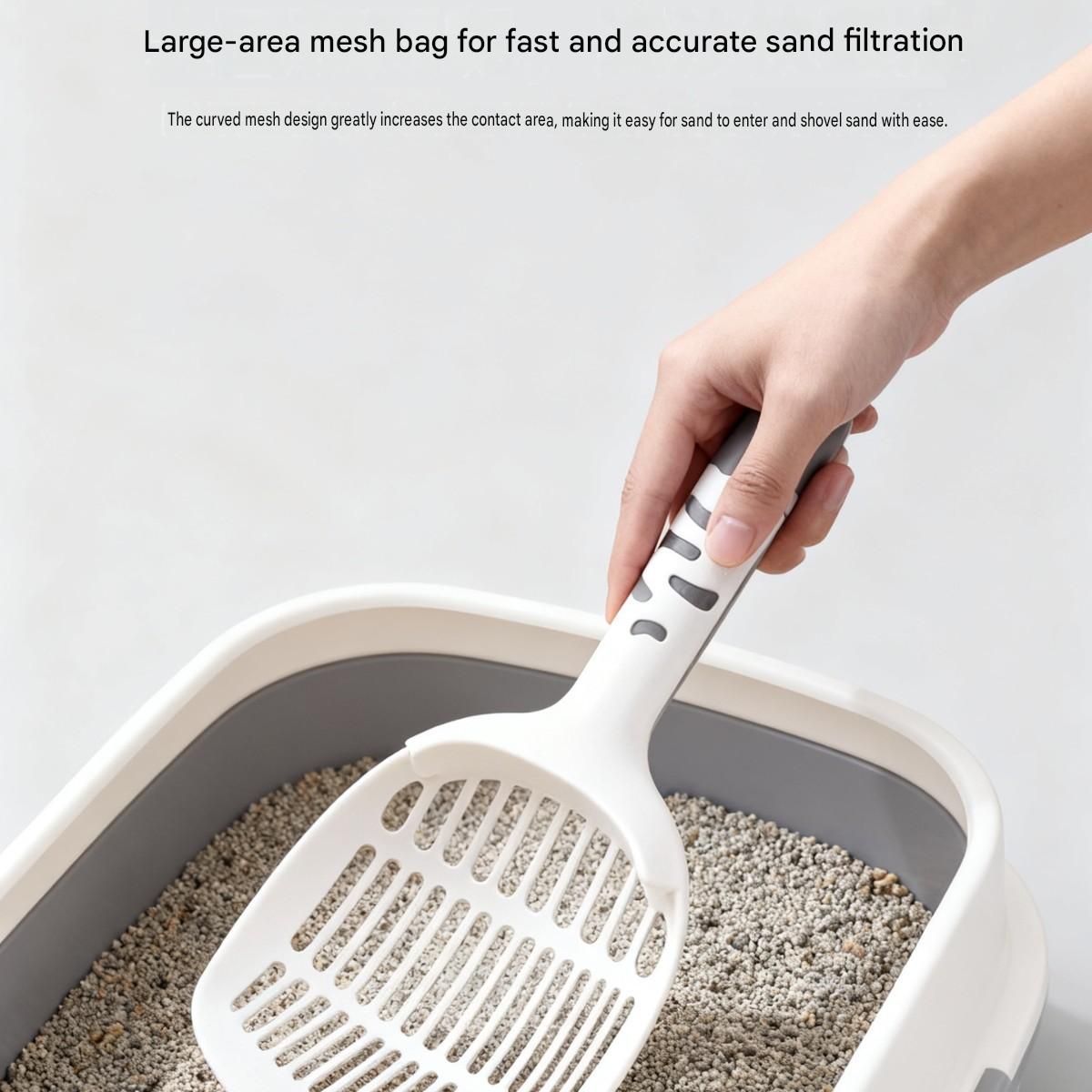 White Large-surface cat litter scoopâ€”made of PP material, featuring a fine-mesh design and an ergonomic handle; 28 cm in length. Suitable for tofu litter and clumping litter; an easy-to-clean tool for clearing away pet waste